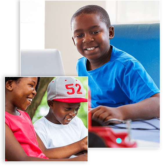 Image of a black kid using a computer