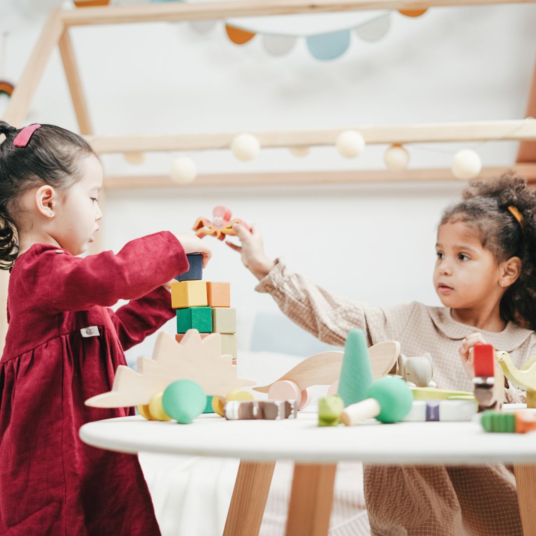 Two little girls socializing and playing together