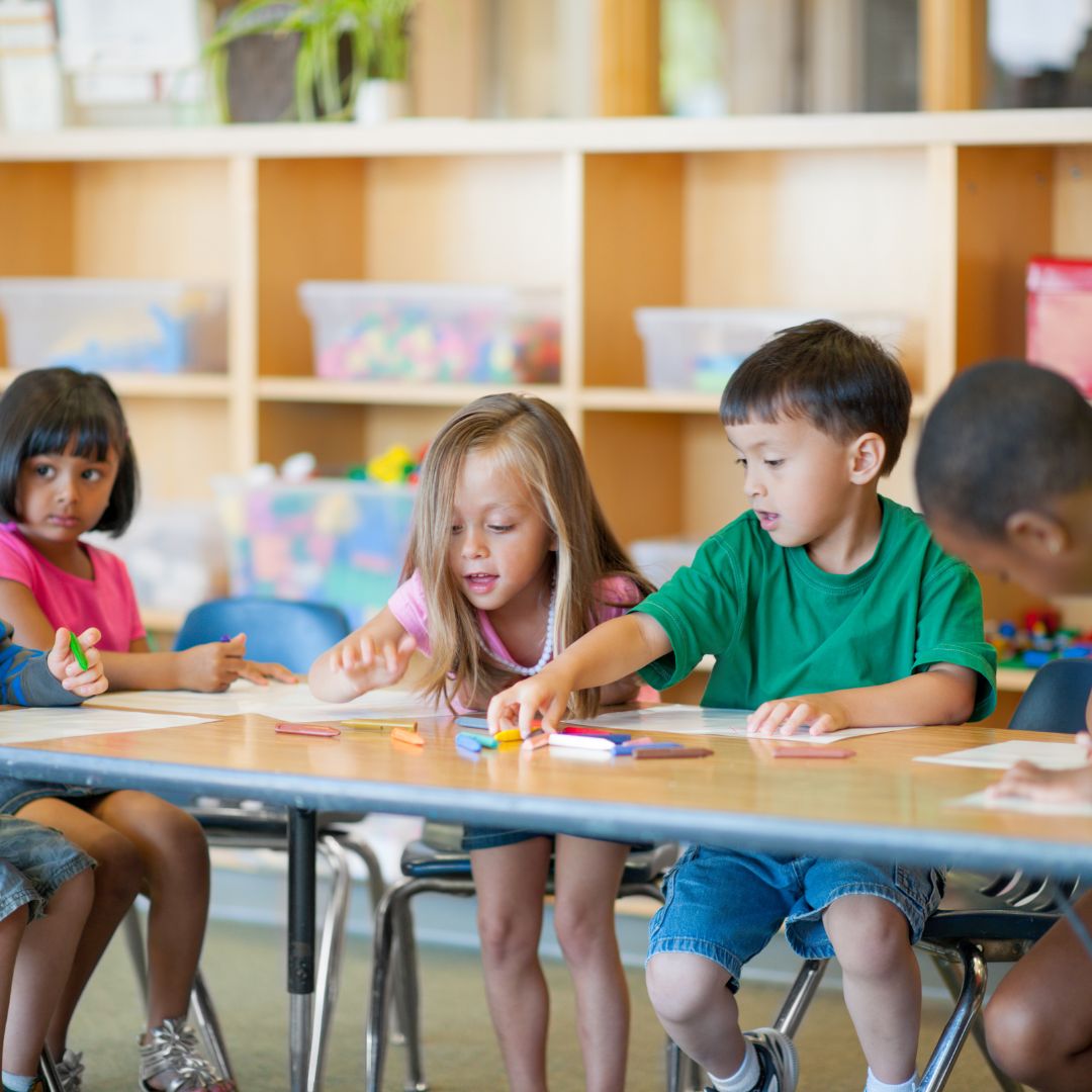 Kids sitting at a school table
