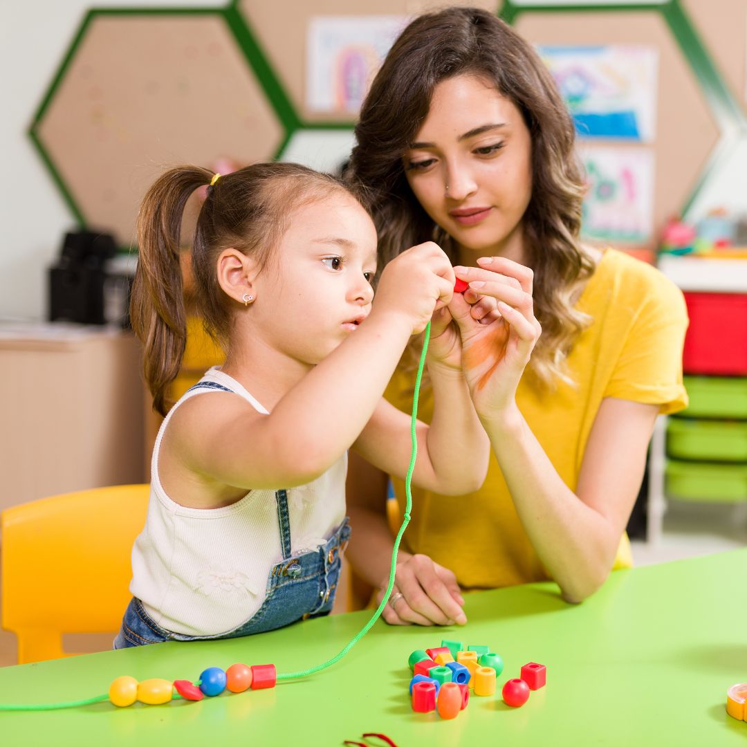 preschooler threading shapes