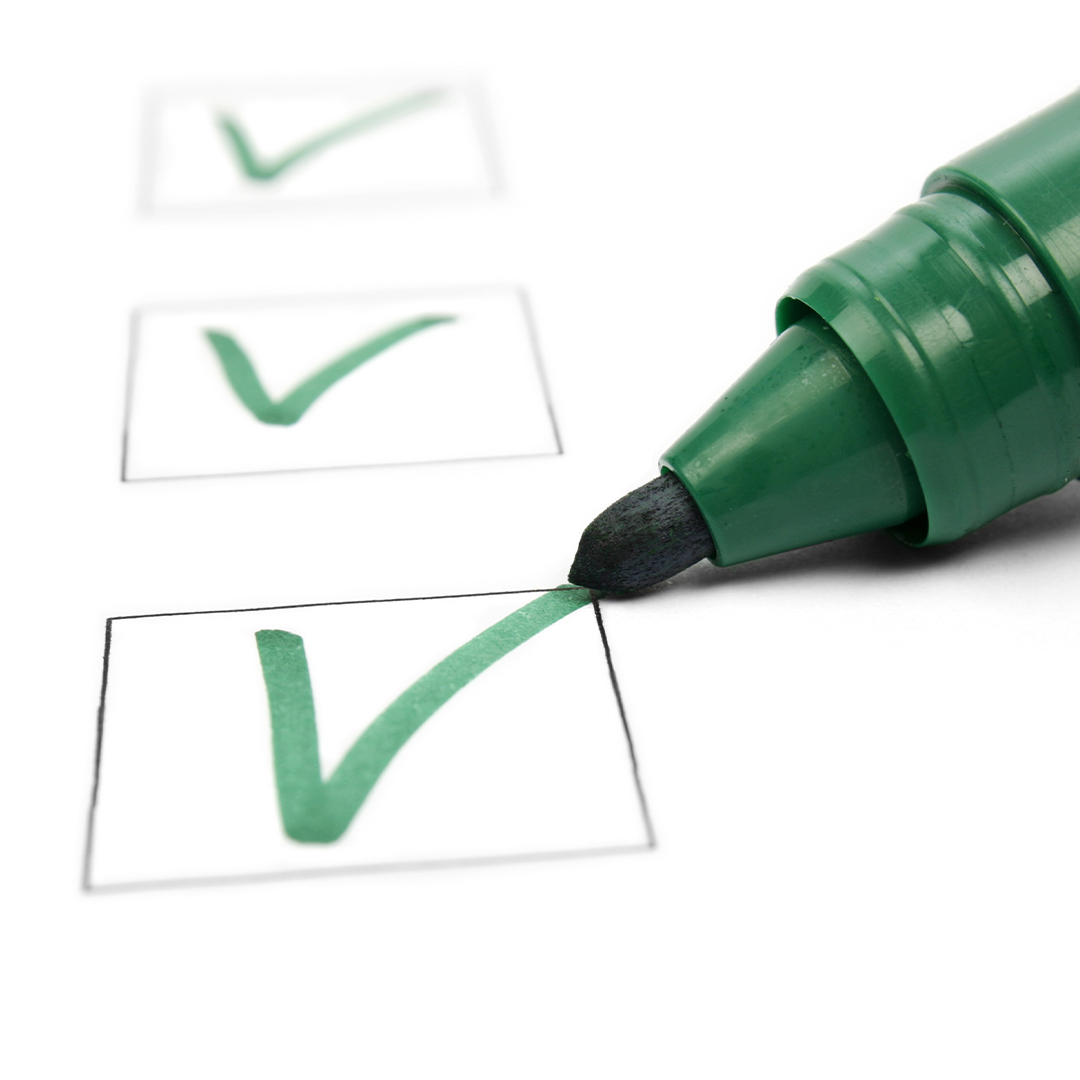 a green sharpie checking off a list