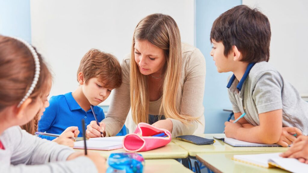 after school educator helping children with homework