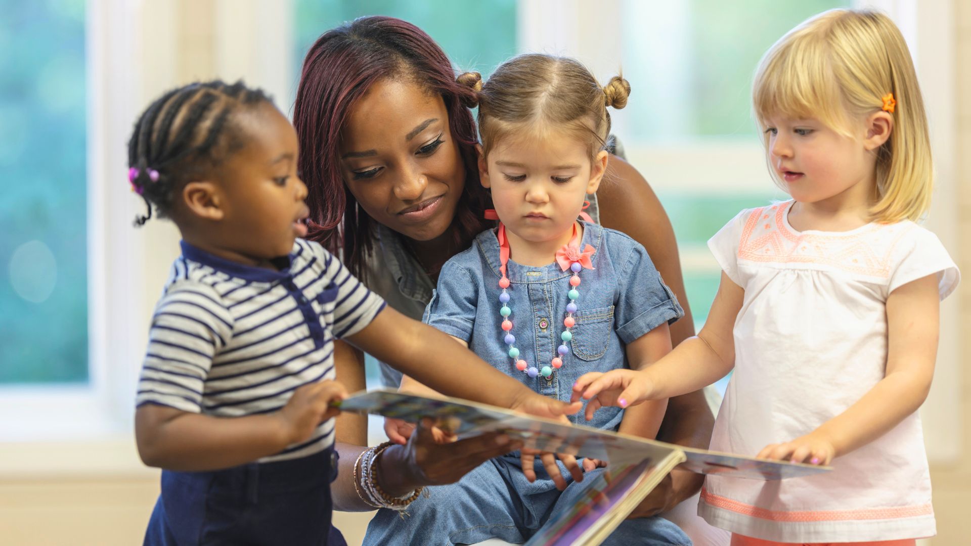 preschool teacher reading to children