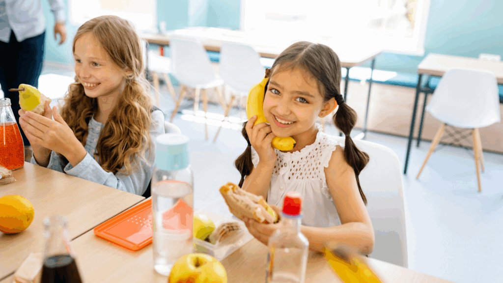 Cute little girl eating healthy snacks